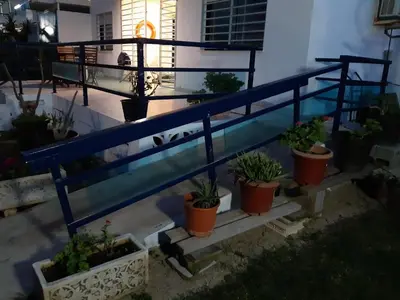 a group of potted plants in pots on a balcony at CANAL SALINAS Solo Familias Serviplaya in Casas Las Basas