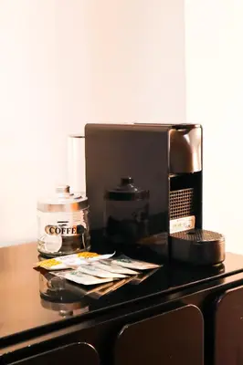 a counter with a coffee maker on a table at Happy Apartments Valencia – Lope de Vega in Valencia