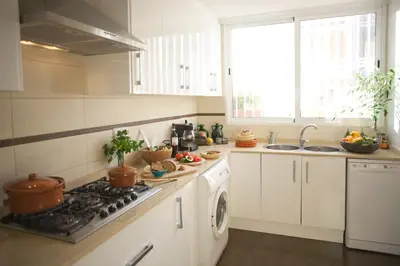 a kitchen with a stove and a sink at Beachfront House, Valencia, Wifi, Paddle Surf Board, Incredible Views in Sueca
