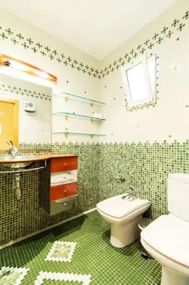a bathroom with a toilet and a sink in it at Estudio para parejas con WIFI en la playa in Valencia