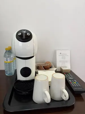 a coffee maker sitting on a tray next to two cups at Pago de Tharsys in Requena