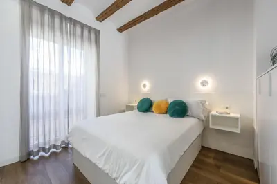 a bedroom with green walls and a bed and a tv at AmazINN Collection Valencia Centro EVI in Valencia