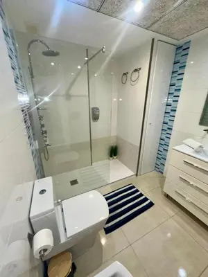a bedroom with two beds and a large window at Marin Beach Apartments Patacona in Valencia