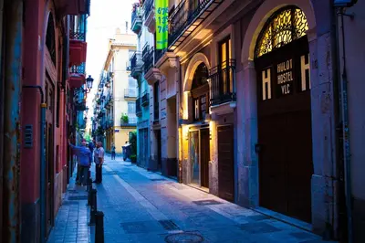 a couple of people walking down a street at Hulot B&B Valencia in Valencia