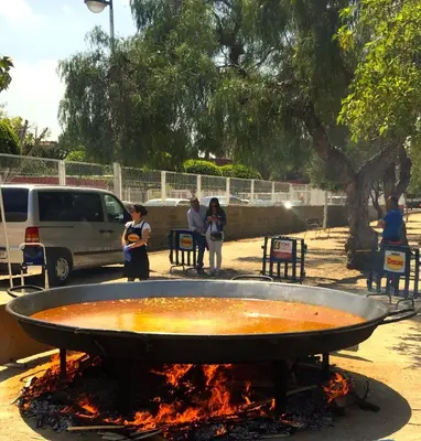 a large fire pit with people standing around it at Cosy flat with excellent location in Valencia! in Valencia