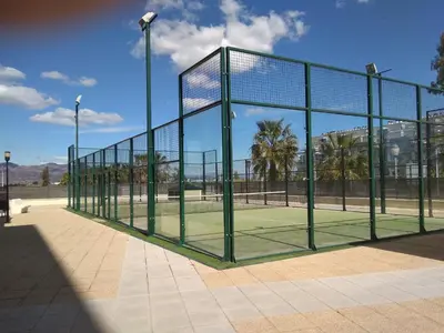 a tennis court with a net on a tennis court at Apartamento Moncofar playa in Moncófar