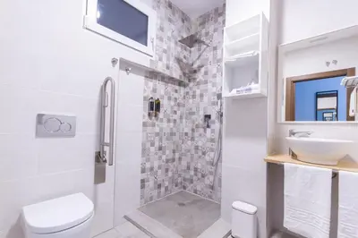 a bathroom with a shower and a toilet and a sink at A Casa Martínez B&B in Valencia