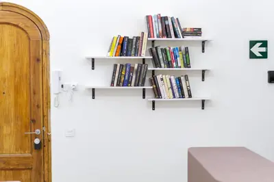 a room with white bookshelves on the wall at A Casa Martínez B&B in Valencia