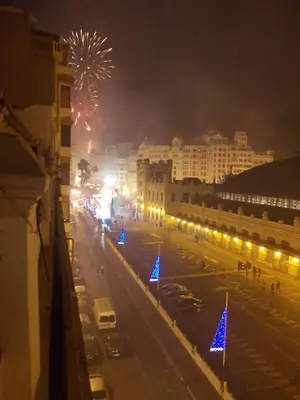 a view of a city street with fireworks at night at Main Central Station Apartment in Valencia
