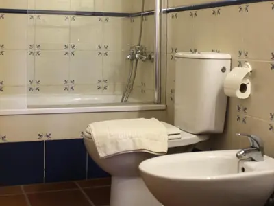 two beds in a hotel room with towels on them at Masia de San Juan - castillo con piscina en plena Sierra Calderona in Segorbe