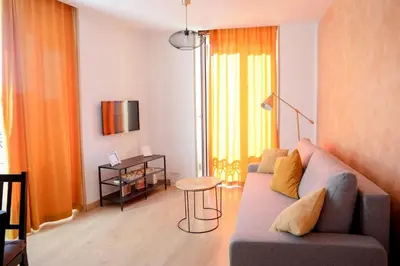 a living room with a couch and a table at Renovado y sofisticado en el centro de Valencia in Valencia