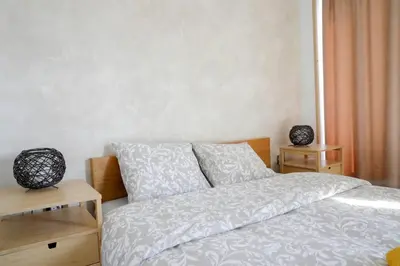 a bedroom with a bed with two night stands next to it at Renovado y sofisticado en el centro de Valencia in Valencia