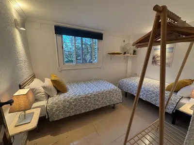 a bedroom with two beds and a bunk bed at LEMON TREE VILLA in Monserrat