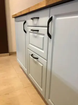a white refrigerator with black handles in a kitchen at Casita privada con encanto en la playa de Valencia in Valencia