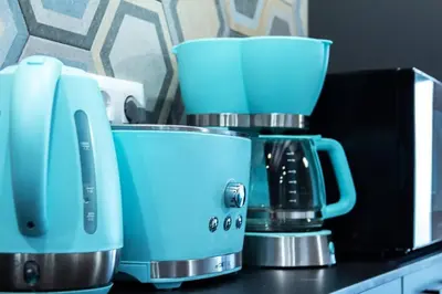 a blue coffee maker sitting on top of a counter at Chic estudio privado al lado de la playa in Valencia