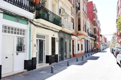 a city street with buildings and parked cars at Chic estudio privado al lado de la playa in Valencia
