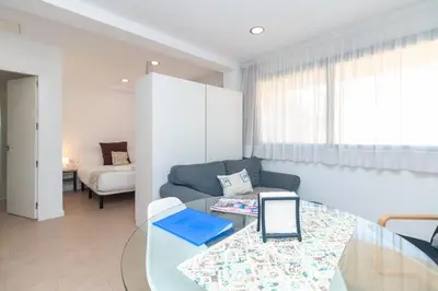 a living room with a couch and a table at BET Apartments - Reig in Valencia