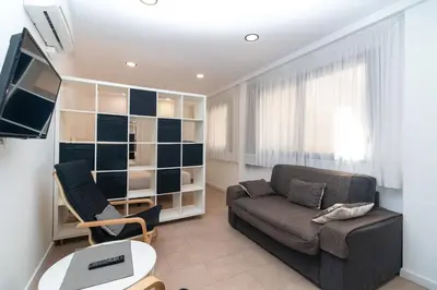 a living room with a couch and a table at BET Apartments - Reig in Valencia