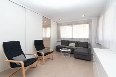 a living room with a couch and chairs at BET Apartments - Reig in Valencia