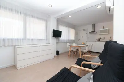a living room with a couch and a table at BET Apartments - Reig in Valencia