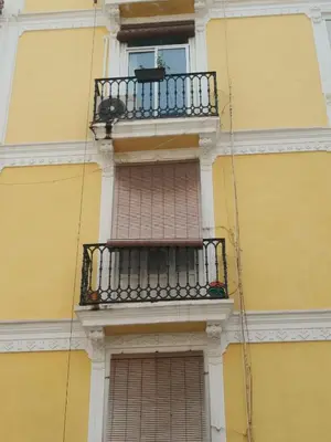 a balcony on the side of a building at Beams & Bricks in Valencia