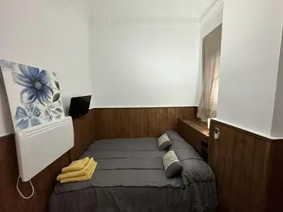a small bedroom with a bed in a room at 5 minuts Ruzzafa, perfect locatión 6PX & Wifi in Valencia