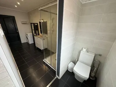 a bathroom with a toilet and a glass shower at 5 minuts Ruzzafa, perfect locatión 6PX & Wifi in Valencia