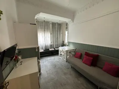 a living room with a couch and a table at 5 minuts Ruzzafa, perfect locatión 6PX & Wifi in Valencia