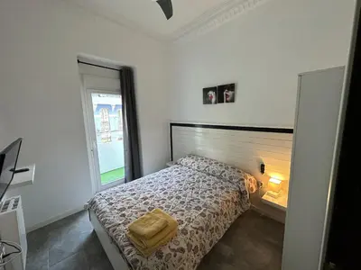 a bedroom with a bed and a window at 5 minuts Ruzzafa, perfect locatión 6PX & Wifi in Valencia
