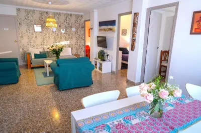 a living room with a couch and a table and chairs at Anna, embrujo de la naturaleza in Anna
