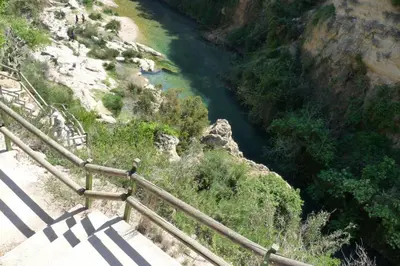 a staircase leading down to a river from a cliff at Anna, embrujo de la naturaleza in Anna