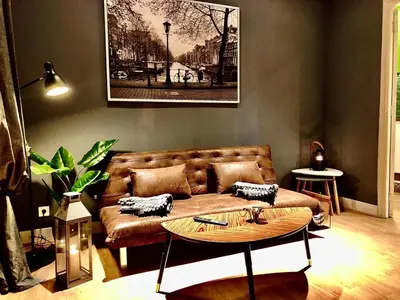 a living room with a couch and a table at València Experience Apartment in Valencia