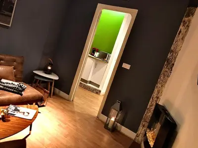 a living room with a green screen on the wall at València Experience Apartment in Valencia