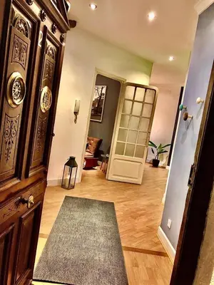a room with a hallway with a wooden floor and a door at València Experience Apartment in Valencia