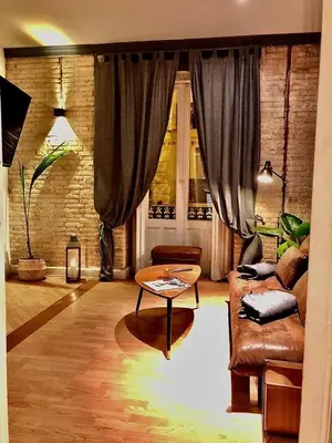 a living room with a couch and a coffee table at València Experience Apartment in Valencia