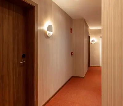 an empty hallway with a door and a corridorngthngthngthngthngthngthngth at SH Suite Palace in Valencia