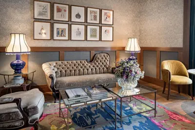 a living room with a couch and a table at Palacio Santa Clara, Autograph Collection in Valencia