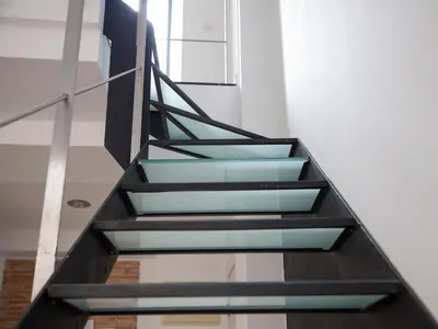 a staircase in a building with blue glass at Flats Friends Tetuan in Valencia