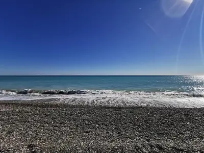 a rocky beach with the ocean in the background at Global Vacacional, Adosado en la playa con piscina in Sagunto