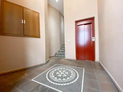 a hallway with a red door and a tile floor at Valencia Centro. Wifi/AACC Jacuzzi in Valencia