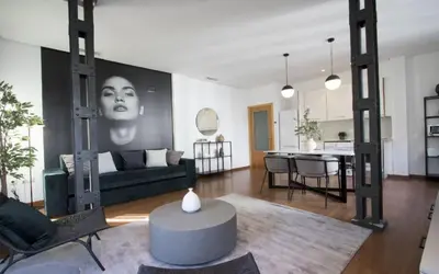 a living room with a couch and a table at Apartamentos San Vicente in Valencia