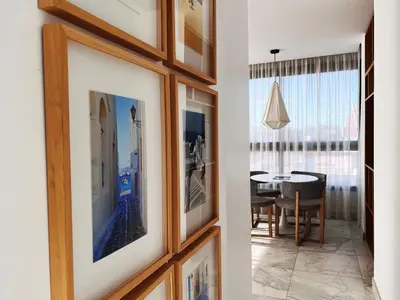 a hallway with a dining room with a table at Valencia Luxury - Calma Beach Apartments in Valencia