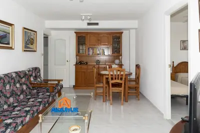 a living room with a couch and a table at Florazar 3, 8º-B in Cullera