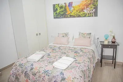 a bedroom with a bed with towels on it at Lovely Modern Flat Valencia center in Valencia