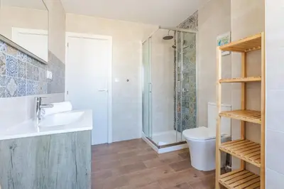 a bathroom with a sink and a shower at Hostal El Perelló, Valencia in El Perelló