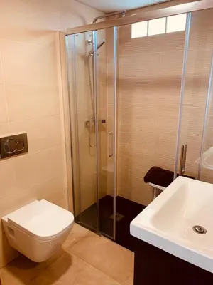 a bathroom with a shower and a toilet and a sink at Casa del Herrero in Chulilla