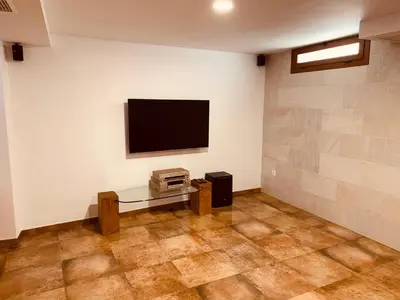 a living room with a flat screen tv on a wall at Casa del Herrero in Chulilla