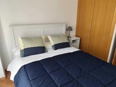 a bedroom with a large blue and white bed at Caudiel entre Sierras in Caudiel
