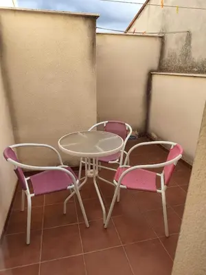 a table and two chairs on a balcony at Caudiel entre Sierras in Caudiel