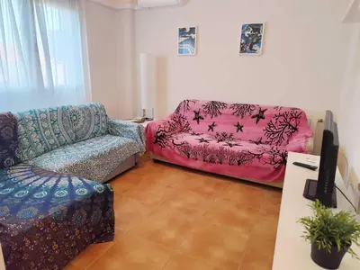 a living room with a couch and a chair at Caudiel entre Sierras in Caudiel